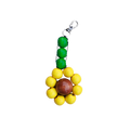 Colorful keychain with green, yellow, and brown beads on a white background