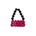 Beaded handbag with black beads on top and pink beads on the bottom on a white background